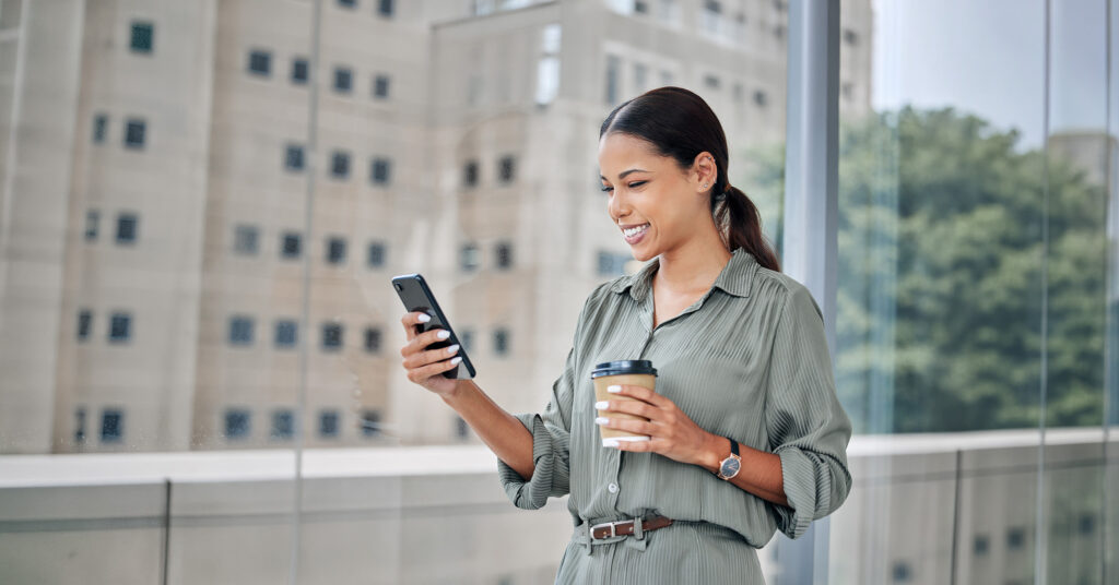 Patient using a mobile device to engage with digital healthcare support services, demonstrating AI-powered patient communication, medication adherence, and personalized engagement solutions.